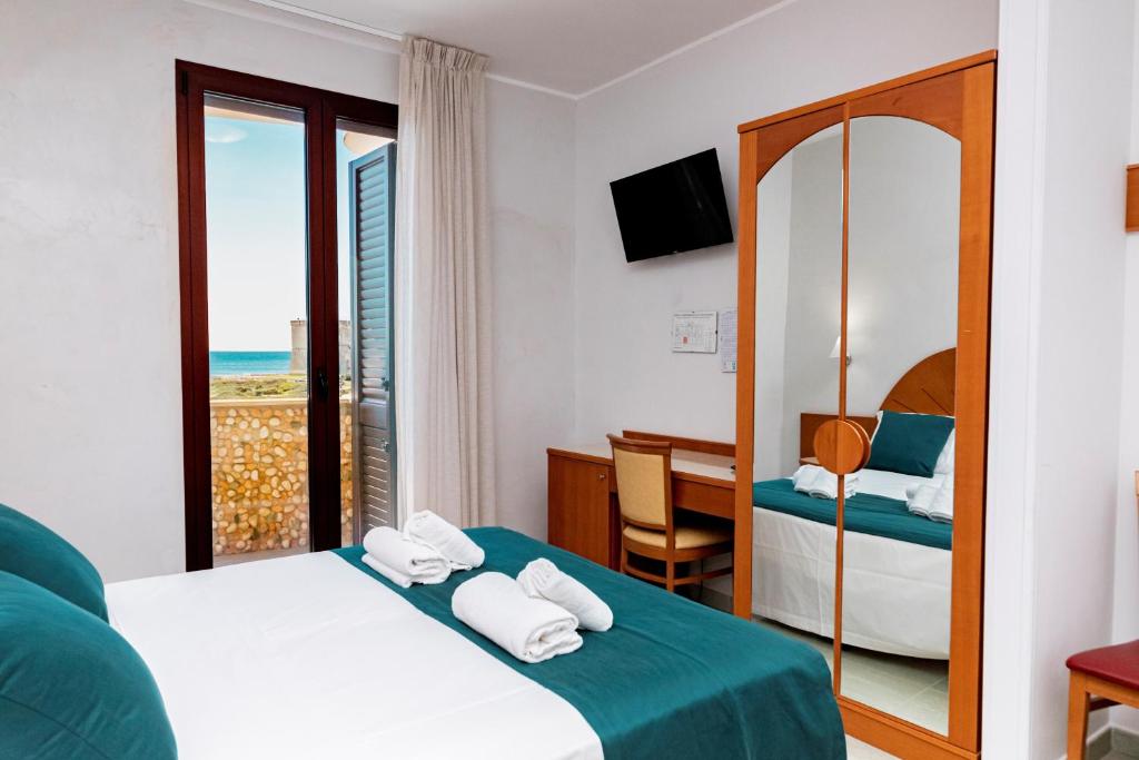 Postel nebo postele na pokoji v ubytování Hotel Alba