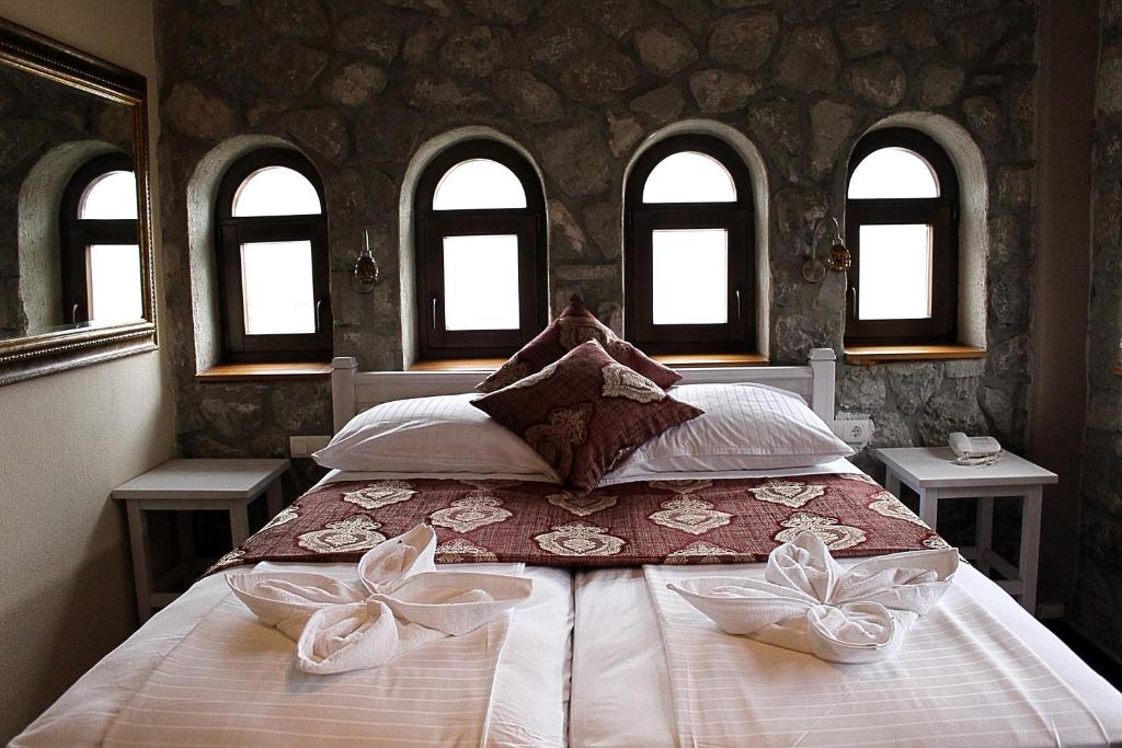 Postel nebo postele na pokoji v ubytování Hotel Divan