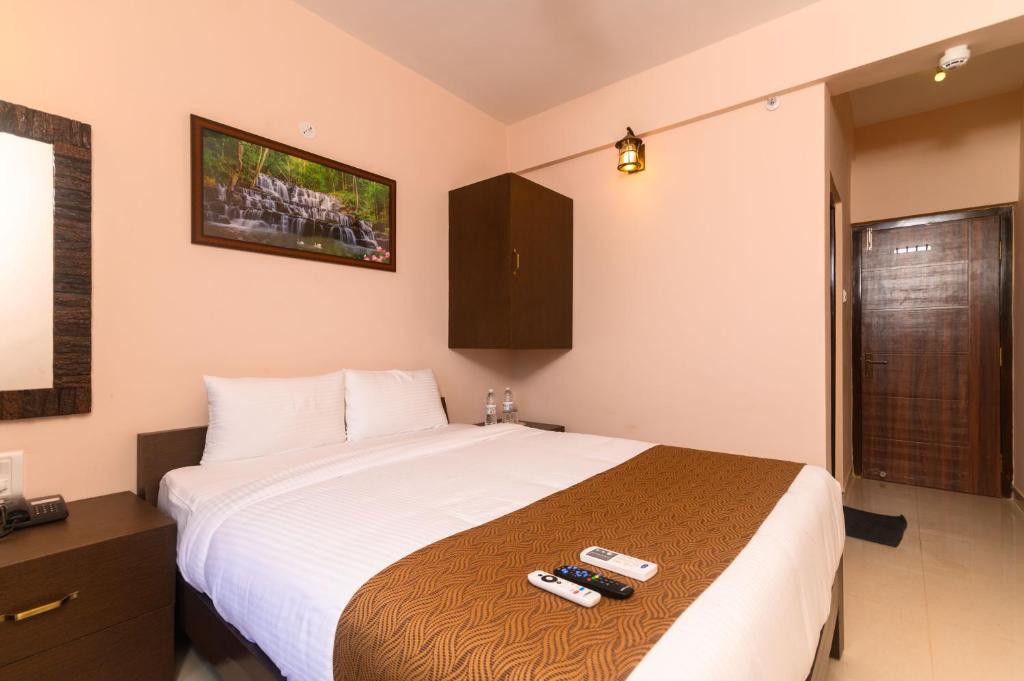 Postel nebo postele na pokoji v ubytování Nazri Hotel - Near Arambol Beach