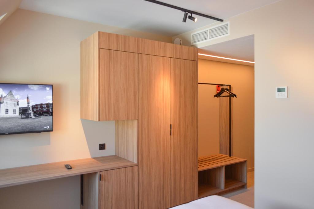 Postel nebo postele na pokoji v ubytování Hotel De Zalm