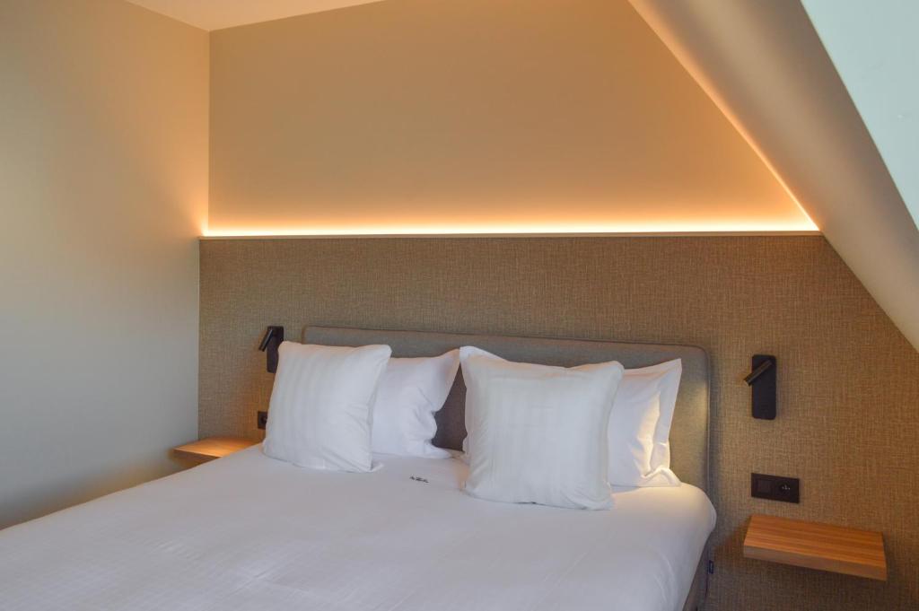 Postel nebo postele na pokoji v ubytování Hotel De Zalm