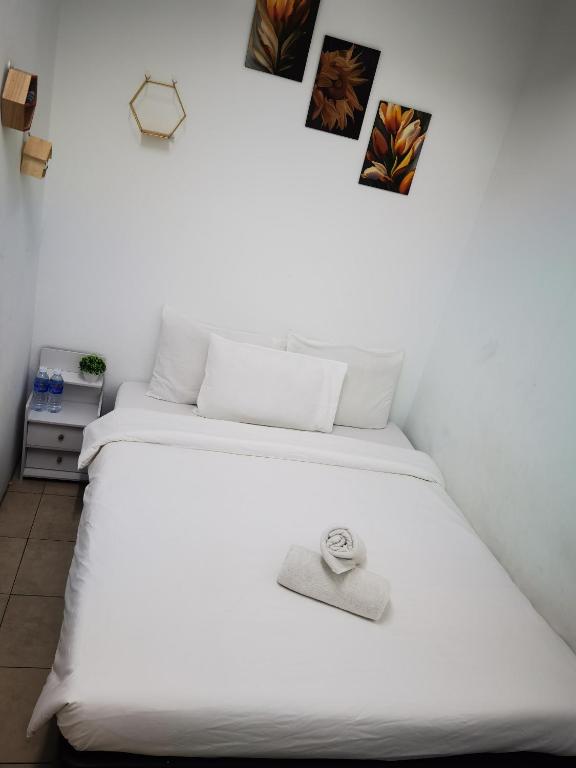 Postel nebo postele na pokoji v ubytování DaY COCON BUKIT BINTANG KL