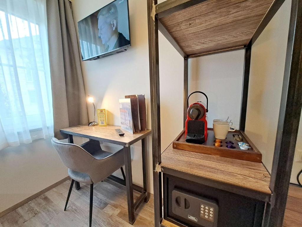 TV a/nebo společenská místnost v ubytování "Das Schlafzimmer" Erlebnis & Boutiquehotel - ehemals Hacienda Mexicana