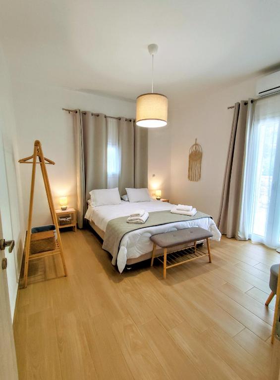 Postel nebo postele na pokoji v ubytování Villa Eftychia
