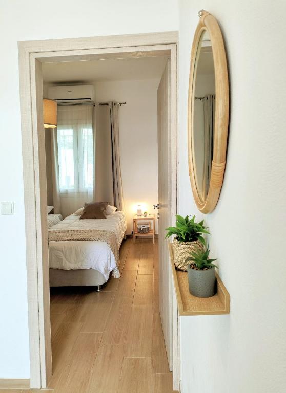 Postel nebo postele na pokoji v ubytování Villa Eftychia