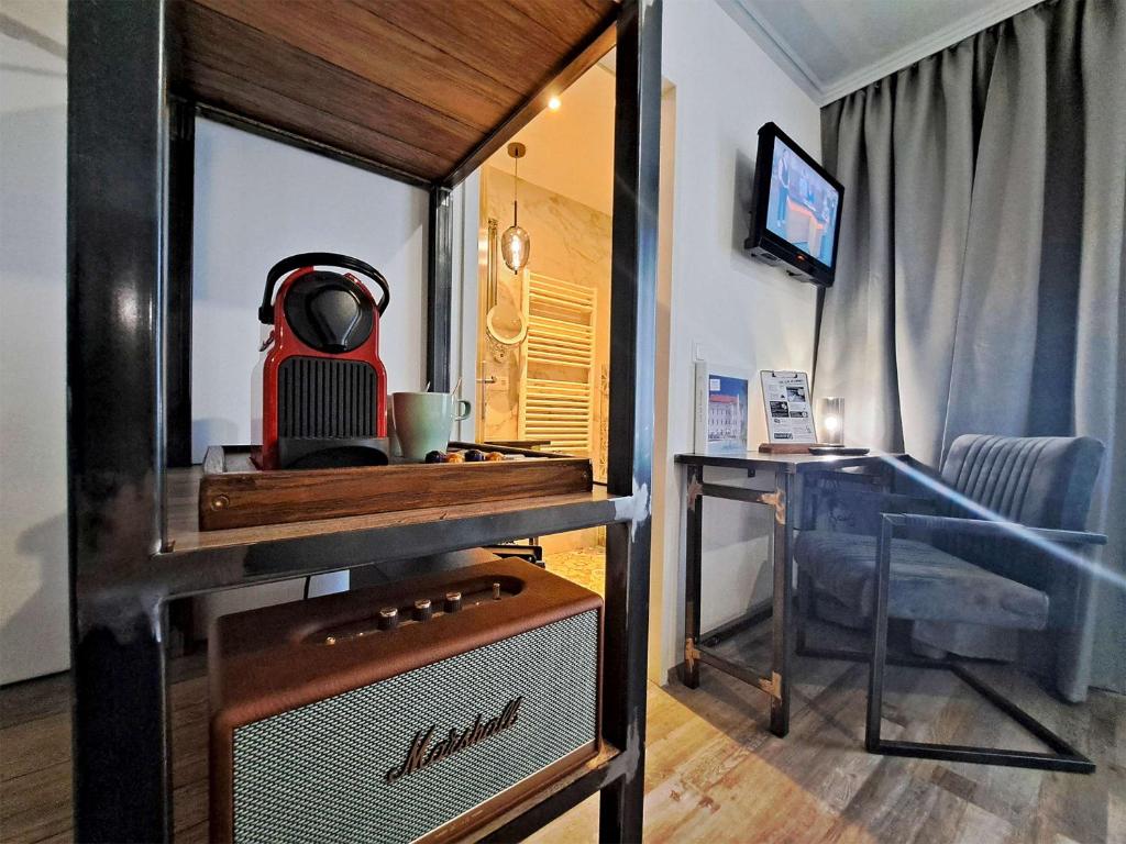 TV a/nebo společenská místnost v ubytování "Das Schlafzimmer" Erlebnis & Boutiquehotel - ehemals Hacienda Mexicana