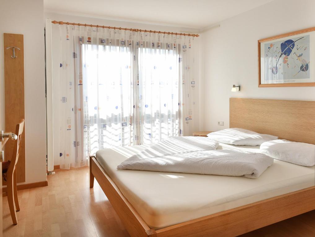 Postel nebo postele na pokoji v ubytování Haus Rosengarten