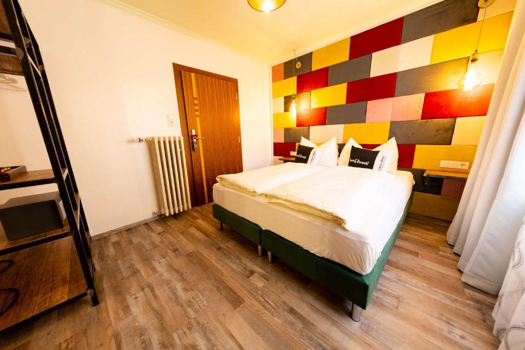 Postel nebo postele na pokoji v ubytování "Das Schlafzimmer" Erlebnis & Boutiquehotel - ehemals Hacienda Mexicana