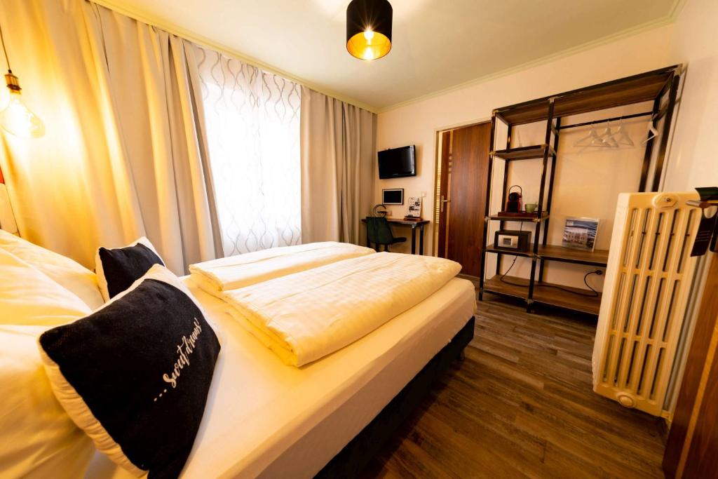 Postel nebo postele na pokoji v ubytování "Das Schlafzimmer" Erlebnis & Boutiquehotel - ehemals Hacienda Mexicana