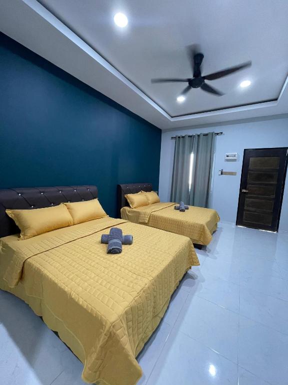 Postel nebo postele na pokoji v ubytování HMI Roomstay