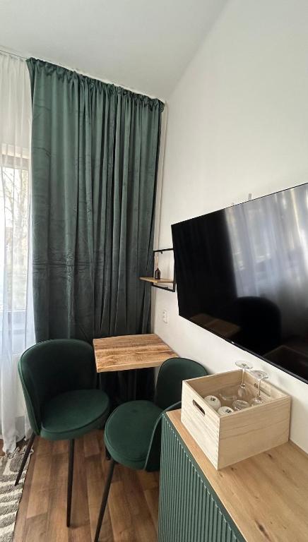 TV a/nebo společenská místnost v ubytování VilaVala