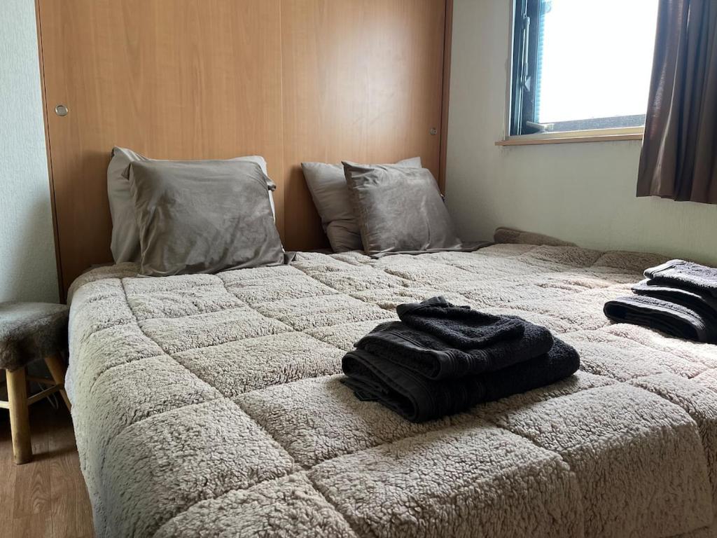Postel nebo postele na pokoji v ubytování Huisje Weltevree Gendt