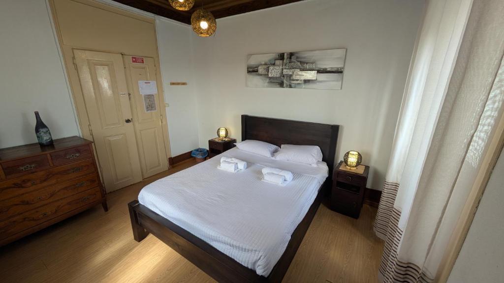 Postel nebo postele na pokoji v ubytování Rei Wamba GuestHouse