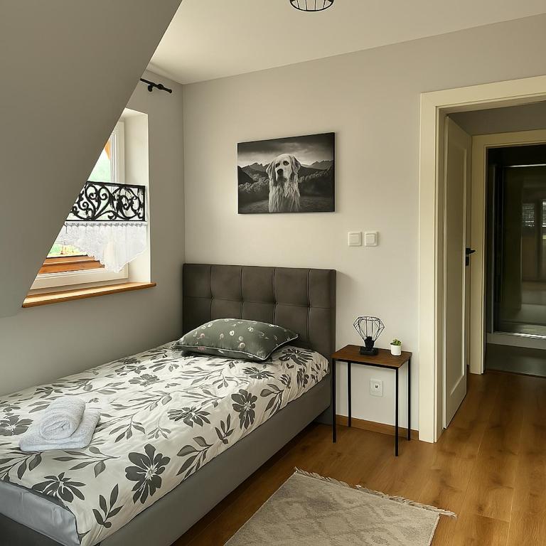 Posteľ alebo postele v izbe v ubytovaní Apartamenty u Moni