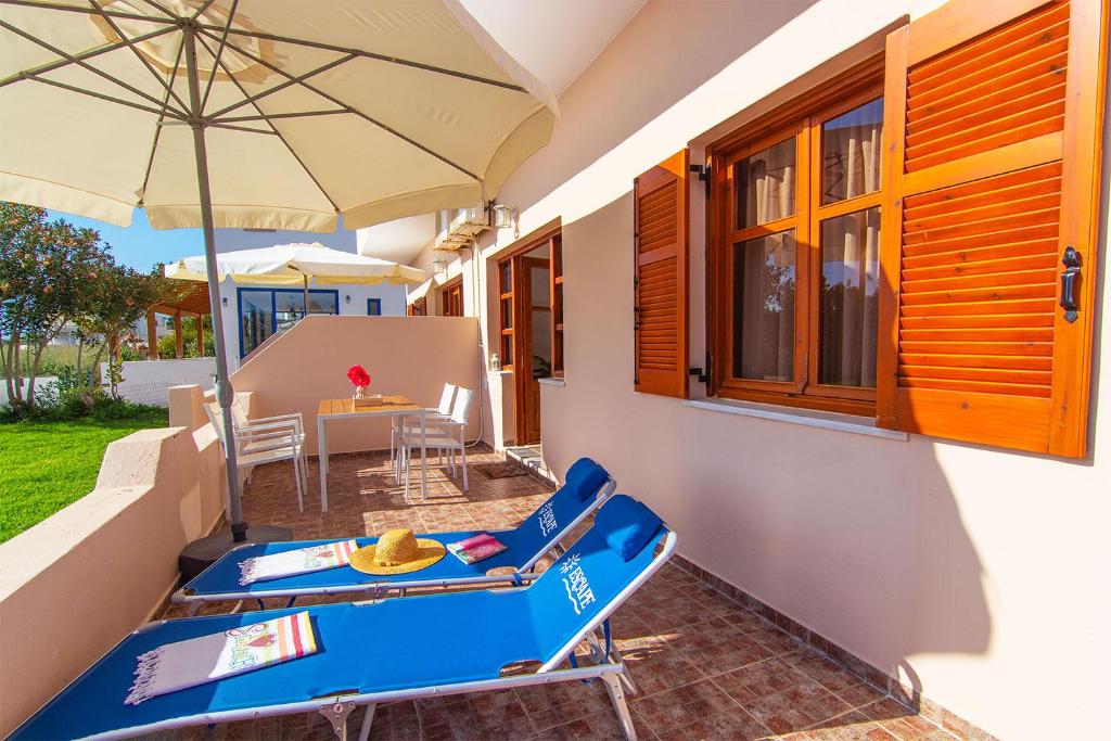 a house with a blue infront of a patio at Liviko Beach Apartments - only adults in Frangokastello