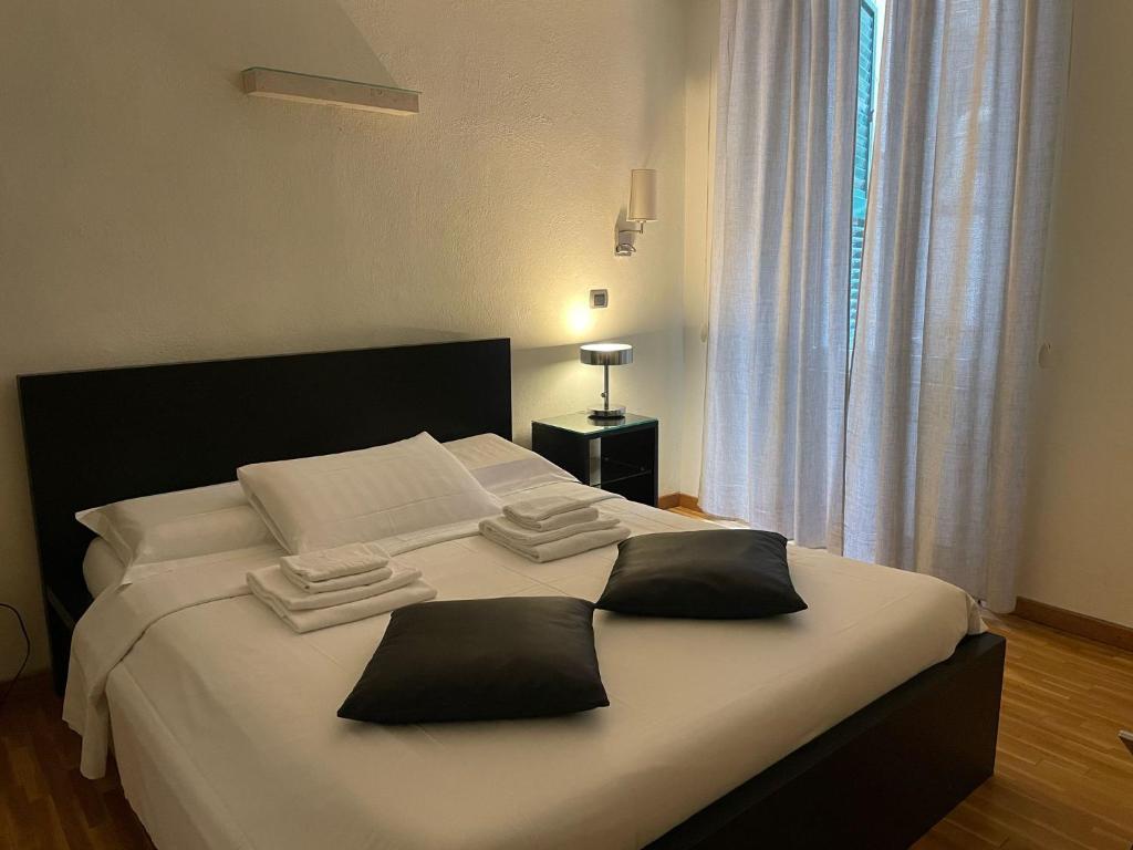 Posteľ alebo postele v izbe v ubytovaní Stefano House appartamento Fontana di Trevi