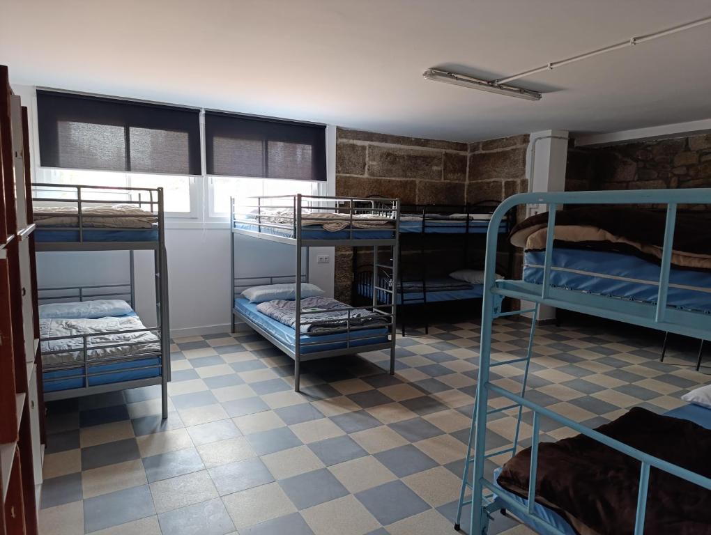 Postel nebo postele na pokoji v ubytování Albergue Villa San Clemente