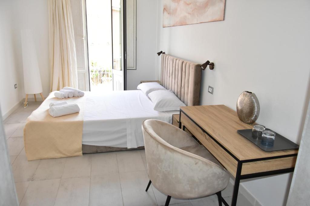 Postel nebo postele na pokoji v ubytování Yllen Rooms