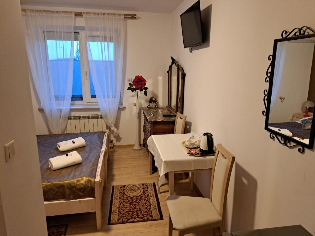 Postel nebo postele na pokoji v ubytování Zajazd Orchidea