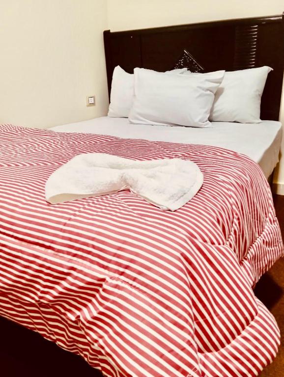 Postel nebo postele na pokoji v ubytování رويال ماجيك