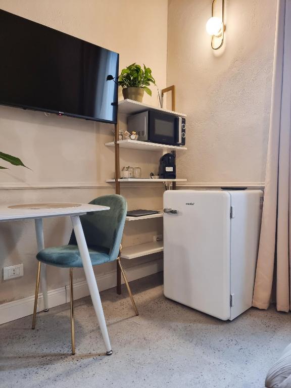 TV a/nebo společenská místnost v ubytování Matteotti 54 Dimora Storica