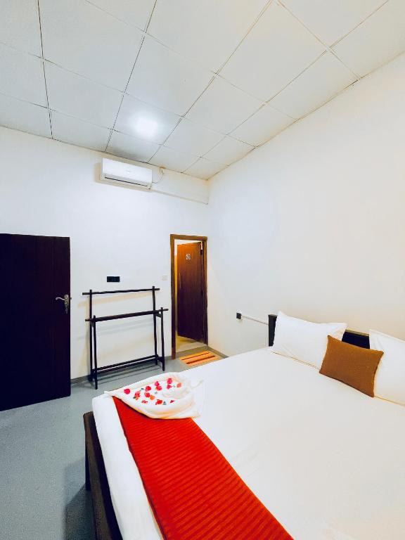 Postel nebo postele na pokoji v ubytování The Wave Rooms & Hostel
