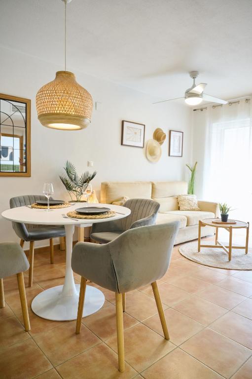 a living room with a table and chairs at Font Roja in Albir