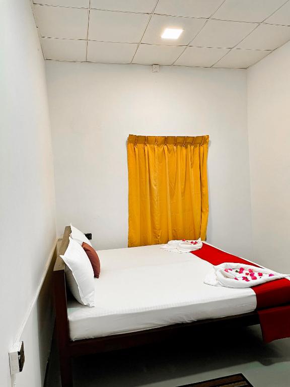 Postel nebo postele na pokoji v ubytování The Wave Rooms & Hostel