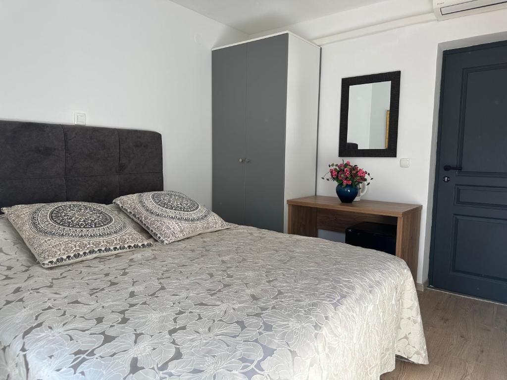 Ένα ή περισσότερα κρεβάτια σε δωμάτιο στο Apartments Tomas II