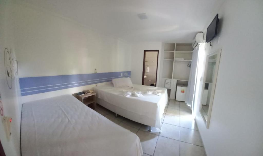 Postel nebo postele na pokoji v ubytování Hotel Ponta de Areia