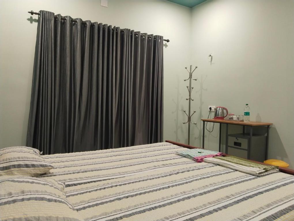 Postel nebo postele na pokoji v ubytování Cherish homestay