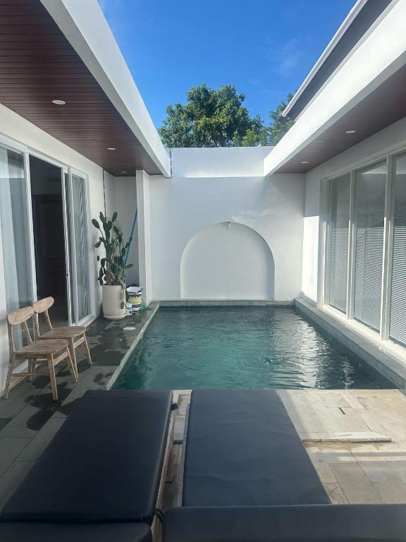 a swimming pool in the backyard of a house at Stylish Villa, 2BR ,GREAT VALUE, Great Location ! in Uluwatu