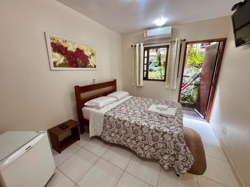 Cama ou camas em um quarto em Yes Hotel Pousada