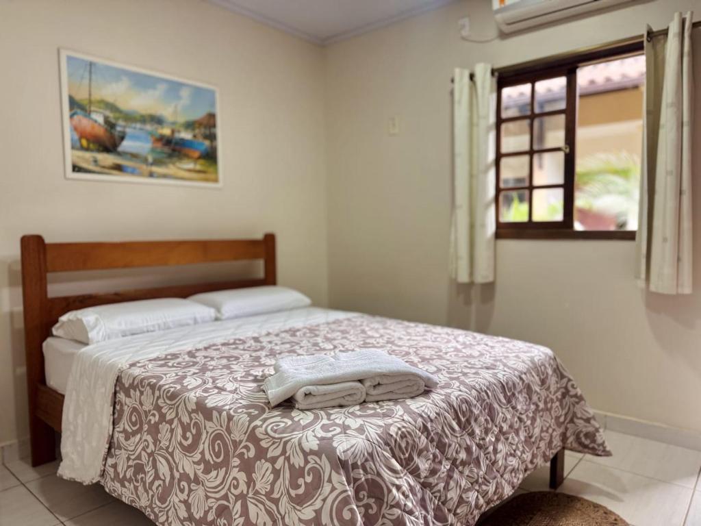 Cama ou camas em um quarto em Yes Hotel Pousada