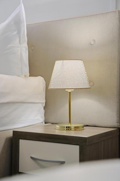 Postel nebo postele na pokoji v ubytování Potaissa Hotel