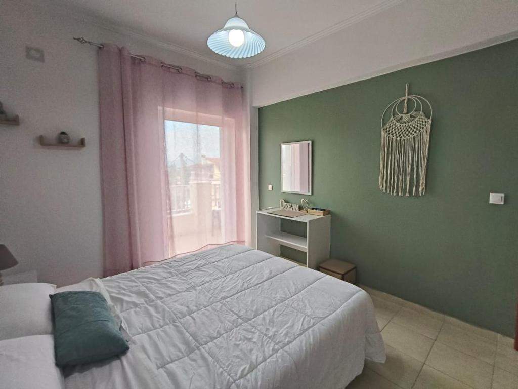 A bed or beds in a room at Dreamy Apartments Corfu