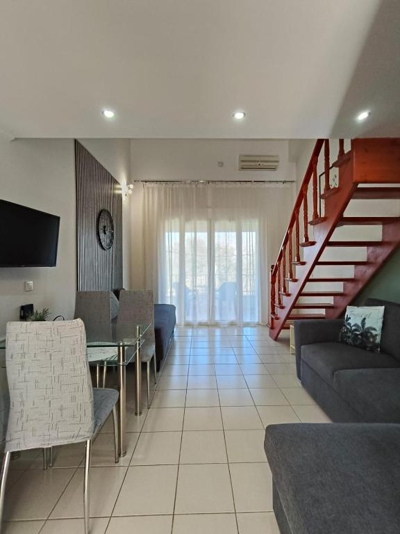 A television and/or entertainment centre at Dreamy Apartments Corfu