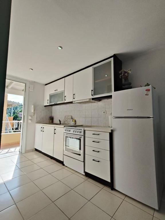A kitchen or kitchenette at Dreamy Apartments Corfu