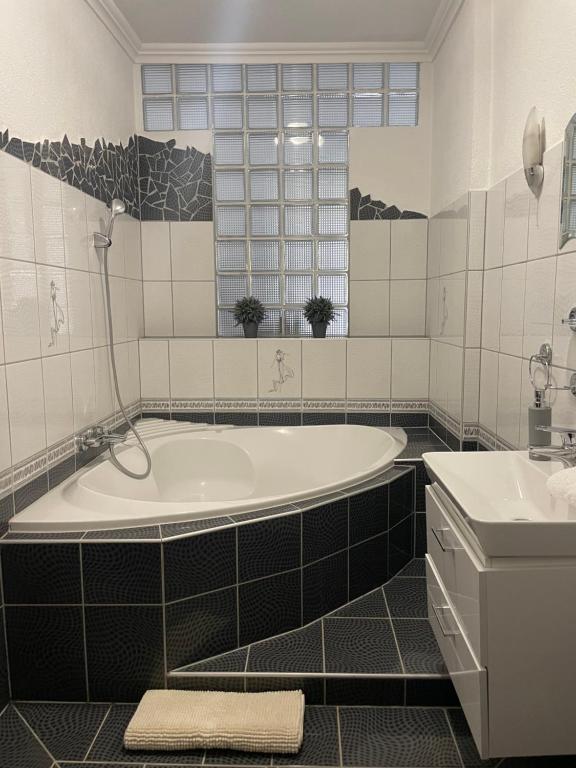 Kúpeľňa v ubytovaní Thermal Next II Weninger Apartman Kiskunhalas
