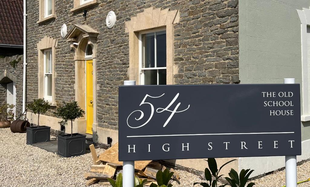 a sign in front of a brick house at The Old School House in Bristol