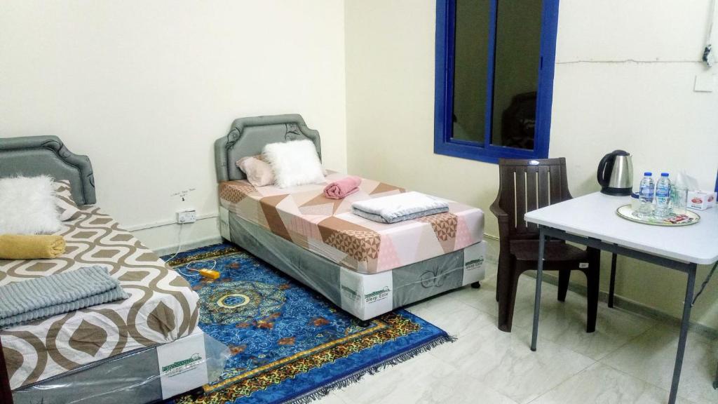 Postel nebo postele na pokoji v ubytování SALEM House Hostel Nizwa