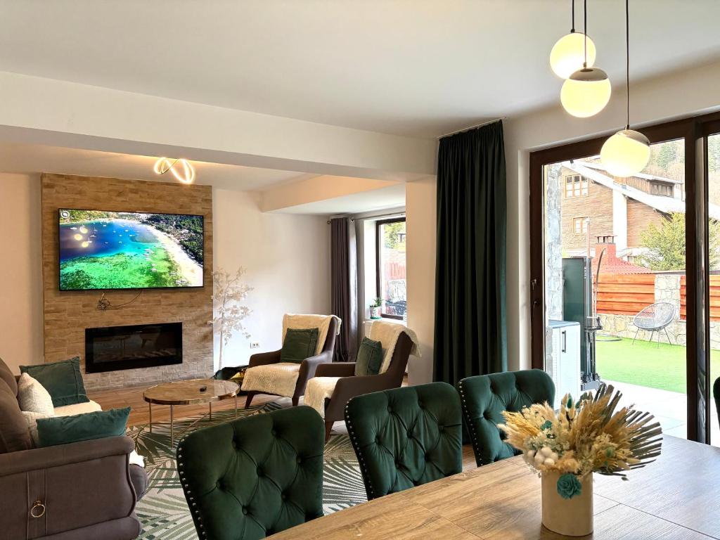 a living room with a table and chairs at Holiday Home in Sinaia in Sinaia