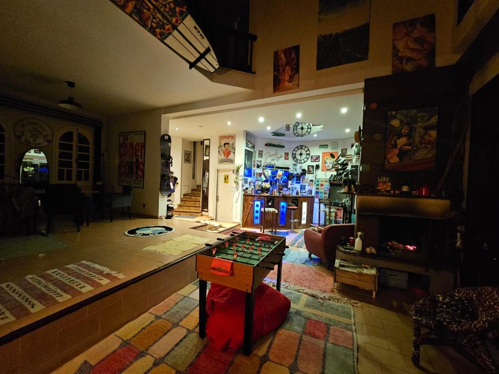 a living room with a table in the middle of a room at Zakiz home in Mohammedia