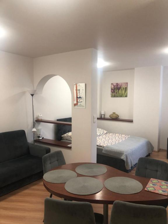 A bed or beds in a room at Apartament studio