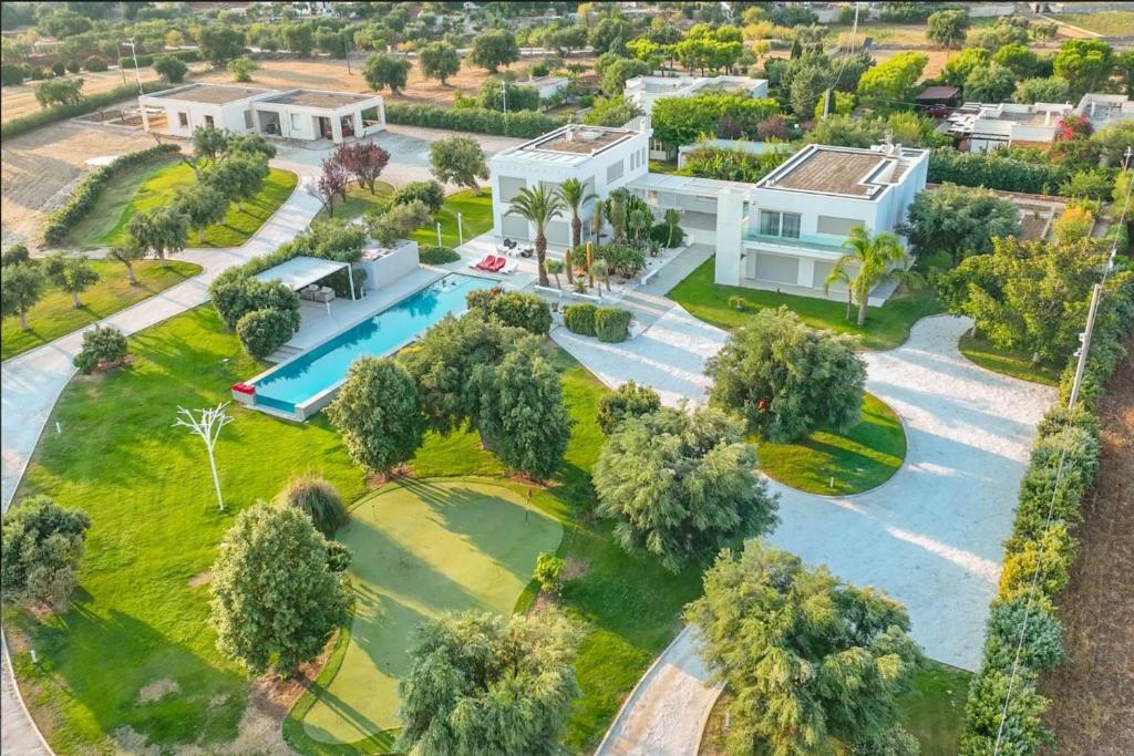 an aerial view of a house with a swimming pool at Villa VINNER - Monopoli in Monopoli