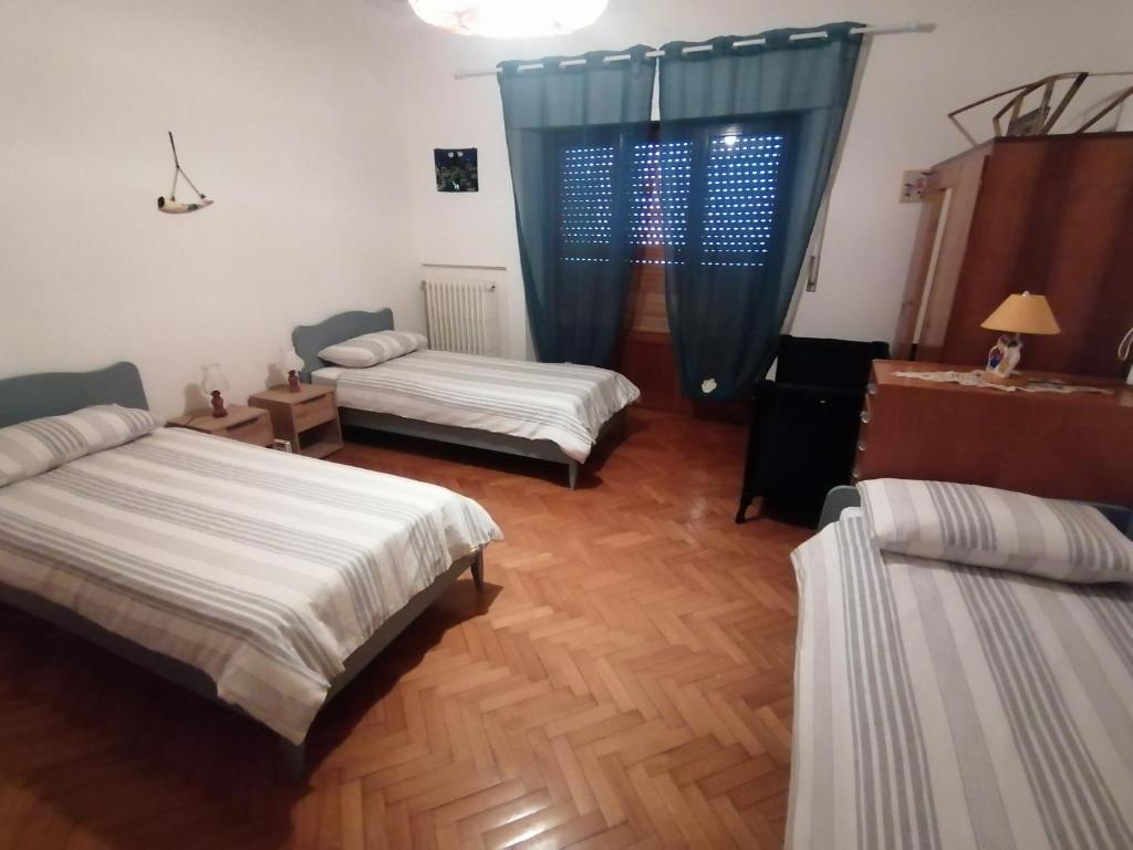 Postel nebo postele na pokoji v ubytování Villetta la Fortezza