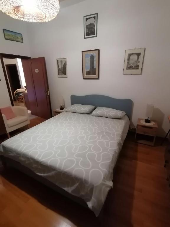 Postel nebo postele na pokoji v ubytování Villetta la Fortezza