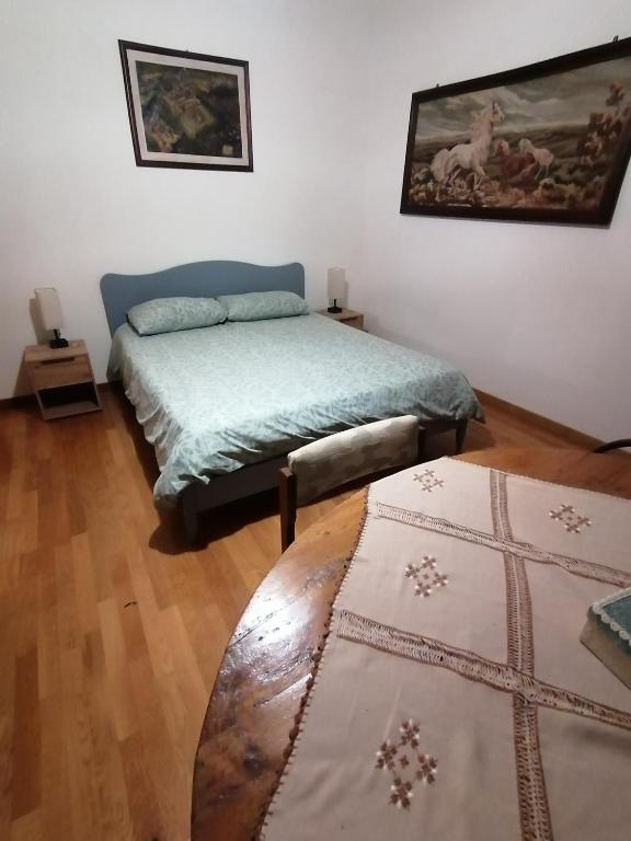 Postel nebo postele na pokoji v ubytování Villetta la Fortezza
