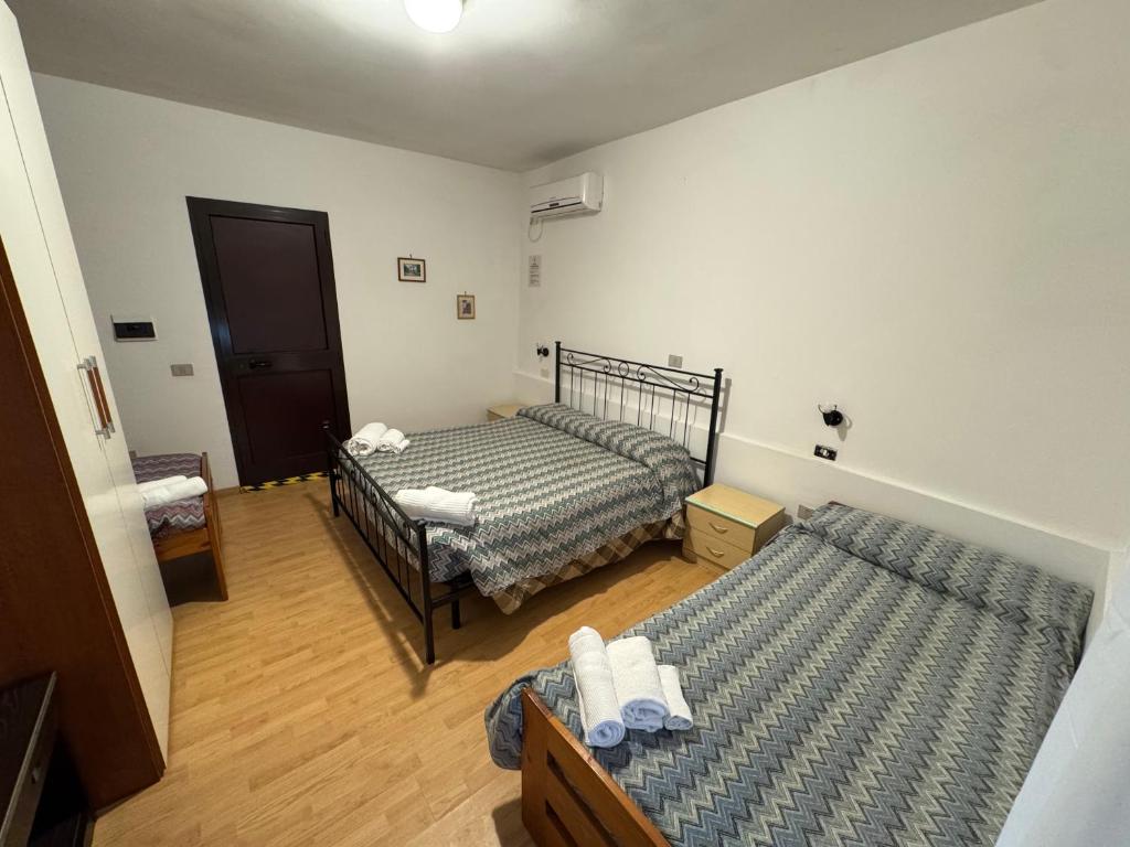 Postel nebo postele na pokoji v ubytování Hotel Paradiso