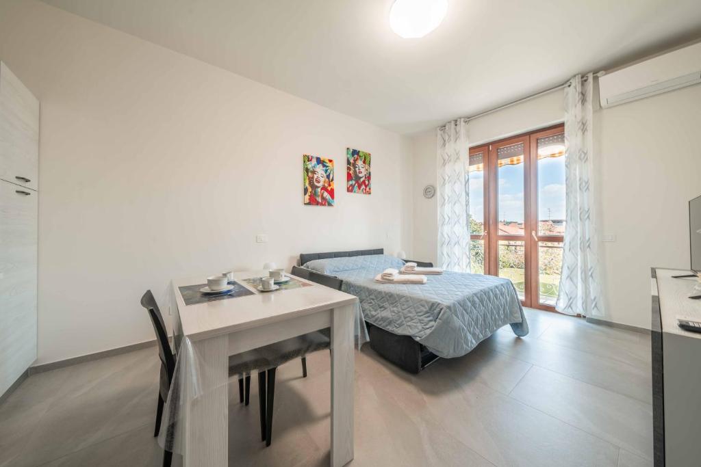 Postel nebo postele na pokoji v ubytování Marilyn - Modern and Cozy Apartment
